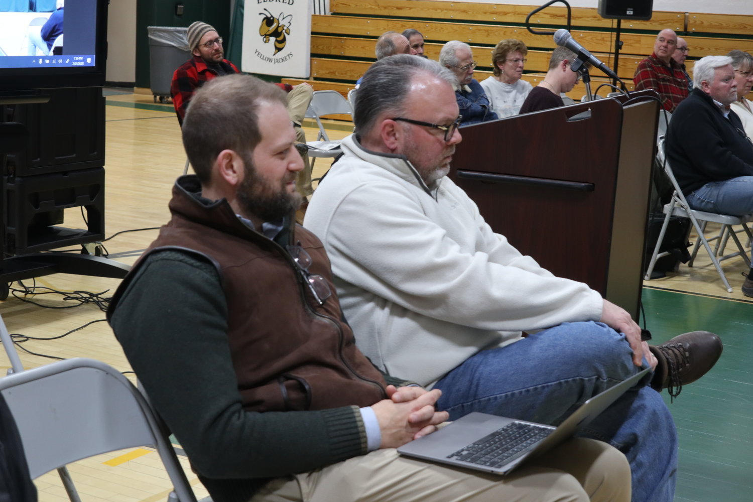 Attorneys Daniel Rubin, left, and Alex Betke listen as National Park Service Camp FIMFO project review letter is read into the record citing concerns and a call for more specific comprehensive planning documents and modeling.